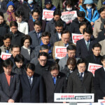 South Korea's main opposition Democratic Party leader Lee Jae-myung and lawmakers observe a tribute of silence during a rally to condemn South Korean President’s surprise declarations of the martial law last night and to call for his resignation, at the national assembly in Seoul, South Korea, December 4, 2024. REUTERS/Kim Hong-Ji