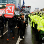 People protest at a rally to condemn South Korean President Yoon Suk Yeol's surprise declarations of the failed martial law and to call for his resignation in Seoul, South Korea, December 5, 2024. REUTERS/Kim Kyung-Hoon