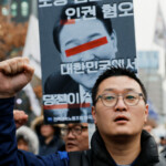 A protester attends a rally to condemn South Korean President Yoon Suk Yeol's surprise declarations of the failed martial law and to call for his resignation in Seoul, South Korea, December 5, 2024. REUTERS/Kim Kyung-Hoon