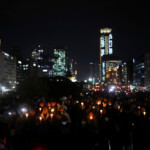People hold candles and signs during a candlelight vigil to demand the resignation of South Korean President Yoon Suk Yeol, who declared martial law which was reversed hours later, at the National Assembly in Seoul, South Korea, December 5, 2024. REUTERS/Kim Hong-ji