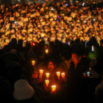 People hold candles and signs during a candlelight vigil to demand the resignation of South Korean President Yoon Suk Yeol, who declared martial law which was reversed hours later, at the National Assembly in Seoul, South Korea, December 5, 2024. REUTERS/Kim Hong-ji TPX IMAGES OF THE DAY