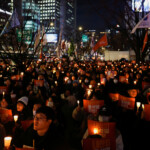 Protesters hold banners reading "Crime of rebellion, Yoon Seok Yeol resign" during a rally to condemn South Korean President Yoon Suk Yeol's surprise declarations of the failed martial law and to call for his resignation in Seoul, South Korea, December 5, 2024. REUTERS/Kim Kyung-Hoon