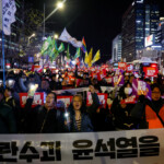 People protest during a candlelight vigil to condemn South Korean President Yoon Suk Yeol's surprise declarations of the failed martial law and to call for his resignation in Seoul, South Korea, December 5, 2024. REUTERS/Kim Kyung-Hoon