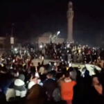 People celebrate as the statue of former President of Syria Hafez al-Assad is toppled in Homs, Syria in this screengrab obtained from a social media video released on December 8, 2024. Social Media/via REUTERS