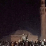 People celebrate after the statue of former President of Syria Hafez al-Assad is toppled by the crowd in Homs, Syria in this screengrab obtained from a social media video released on December 8, 2024. Social Media/via REUTERS