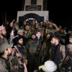 Rebel fighters gather in Homs after Syria's army command notified officers on Sunday that President Bashar al-Assad's 24-year authoritarian rule has ended, a Syrian officer who was informed of the move told Reuters, following a rapid rebel offensive that took the world by surprise, in Homs, Syria December 8, 2024. REUTERS/Mahmoud Hasano