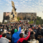 People gather at Saadallah al-Jabiri Square as they celebrate, after Syria's army command notified officers on Sunday that President Bashar al-Assad's 24-year authoritarian rule has ended, a Syrian officer who was informed of the move told Reuters, following a rapid rebel offensive that took the world by surprise, in Aleppo, Syria December 8, 2024. REUTERS/Karam al-Masri