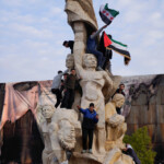 People gather at Saadallah al-Jabiri Square as they celebrate, after Syria's army command notified officers on Sunday that President Bashar al-Assad's 24-year authoritarian rule has ended, a Syrian officer who was informed of the move told Reuters, following a rapid rebel offensive that took the world by surprise, in Aleppo, Syria December 8, 2024. REUTERS/Karam al-Masri