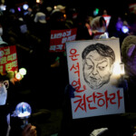 Protesters attend a rally calling for the impeachment of South Korean President Yoon Suk Yeol, who declared martial law, which was reversed hours later, in Seoul, South Korea, December 9, 2024. REUTERS/Kim Kyung-Hoon