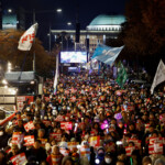 Protesters attend a rally calling for the impeachment of South Korean President Yoon Suk Yeol, who declared martial law, which was reversed hours later, in front of the National Assembly in Seoul, South Korea, December 9, 2024. REUTERS/Kim Kyung-Hoon