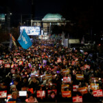 Protesters attend a rally calling for the impeachment of South Korean President Yoon Suk Yeol, who declared martial law, which was reversed hours later, in front of the National Assembly in Seoul, South Korea, December 9, 2024. REUTERS/Kim Kyung-Hoon