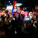 Protesters attend a rally calling for the impeachment of South Korean President Yoon Suk Yeol, who declared martial law, which was reversed hours later, in front of the National Assembly in Seoul, South Korea, December 9, 2024. REUTERS/Kim Kyung-Hoon