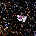 Protesters attend a rally calling for the impeachment of South Korean President Yoon Suk Yeol, who declared martial law, which was reversed hours later, in front of the headquarters of the ruling People Power Party, in Seoul, South Korea, December 9, 2024. REUTERS/Kim Kyung-Hoon