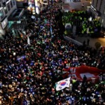 Protesters attend a rally calling for the impeachment of South Korean President Yoon Suk Yeol, who declared martial law, which was reversed hours later, in front of the headquarters of the ruling People Power Party, in Seoul, South Korea, December 9, 2024. REUTERS/Kim Kyung-Hoon