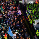 Protesters attend a rally calling for the impeachment of South Korean President Yoon Suk Yeol, who declared martial law, which was reversed hours later, in front of the headquarters of the ruling People Power Party, in Seoul, South Korea, December 9, 2024. REUTERS/Kim Kyung-Hoon