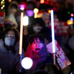 Protesters attend a rally calling for the impeachment of South Korean President Yoon Suk Yeol, who declared martial law, which was reversed hours later, in front of the National Assembly in Seoul, South Korea, December 10, 2024. REUTERS/Kim Hong-Ji