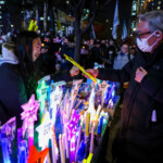 Shopkeeper sells light sticks that read "Yoon Suk Yeol OUT" during a rally calling for the impeachment of South Korean President Yoon Suk Yeol, who declared martial law, which was reversed hours later, in front of the National Assembly in Seoul, South Korea, December 10, 2024. REUTERS/Kim Hong-Ji