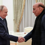 Russian President Vladimir Putin shakes hands with Indian Defence Minister Rajnath Singh during a meeting in Moscow, Russia December 10, 2024. Sputnik/Alexander Kazakov/Pool via REUTERS
