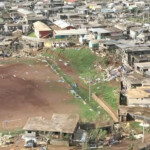 Damaged houses remain and debris lies on the ground after Cyclone Chido swept through Mayotte, France in this screengrab taken from a handout video obtained by Reuters on December 15, 2024. Video taken with a drone. French Civil Security/Handout via REUTERS