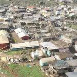 Damaged houses remain and debris lies on the ground after Cyclone Chido swept through Mayotte, France in this screengrab taken from a handout video obtained by Reuters on December 15, 2024. Video taken with a drone. French Civil Security/Handout via REUTERS
