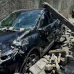 The wreckage of a car lies outside a home, in the aftermath of Cyclone Chido, within Labattoir, in Mayotte, France, December 15, 2024. REUTERS/Chafion Madi