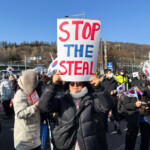 Park Chae-yeon, 53, a supporter of the impeached South Korean President Yoon Suk Yeol, holds up a banner that reads 'STOP THE STEAL' at a rally near Yoon's official residence as he faces potential arrest after a court on Tuesday approved a warrant for his arrest, in Seoul, South Korea, January 3, 2025. REUTERS/Minwoo Park
