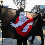 A protester holds a flag during a rally against the impeached South Korean President Yoon Suk Yeol near his official residence, after investigators were unable to execute an arrest warrant on Friday for Yoon, according to the Corruption Investigation Office for High-ranking Officials, in Seoul, South Korea, January 3, 2025. REUTERS/Kim Hong-Ji