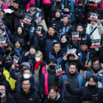 Anti-Yoon protesters holding signs that read, "Arrest Yoon Suk Yeol immediately," march towards impeached South Korean President Yoon Suk Yeol's official residence, after investigators were unable to execute an arrest warrant on Friday for Yoon according to the Corruption Investigation Office for High-ranking Officials, in Seoul, South Korea, January 3, 2025. REUTERS/Kim Hong-Ji