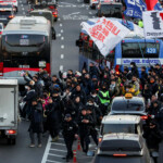 Anti-Yoon protesters march towards impeached South Korean President Yoon Suk Yeol's official residence, after investigators were unable to execute an arrest warrant on Friday for Yoon according to the Corruption Investigation Office for High-ranking Officials, in Seoul, South Korea, January 3, 2025. REUTERS/Kim Hong-Ji