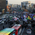 Anti-Yoon protesters block traffic as they march towards impeached South Korean President Yoon Suk Yeol's official residence, after investigators were unable to execute an arrest warrant on Friday for Yoon according to the Corruption Investigation Office for High-ranking Officials, in Seoul, South Korea, January 3, 2025. REUTERS/Kim Hong-Ji