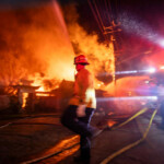 Firefighters battle the Palisades fire as it burns during a windstorm on the west side of Los Angeles, California, U.S. January 8, 2025. REUTERS/Ringo Chiu