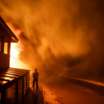 A firefighter battles the Palisades fire as it burns during a windstorm on the west side of Los Angeles, California, U.S. January 8, 2025. REUTERS/Ringo Chiu