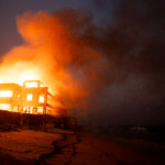 Flames and smoke rise from a structure as the Palisades fire burns during a windstorm on the west side of Los Angeles, California, U.S. January 8, 2025. REUTERS/Ringo Chiu