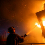 A firefighter battles the Palisades fire as it burns during a windstorm on the west side of Los Angeles, California, U.S. January 8, 2025. REUTERS/Ringo Chiu