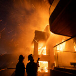 Firefighters battle the Palisades fire as it burns during a windstorm on the west side of Los Angeles, California, U.S. January 8, 2025. REUTERS/Ringo Chiu