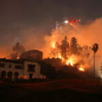Flames rise from the Sunset Fire in the hills overlooking the Hollywood neighborhood of Los Angeles, California, U.S. January 8, 2025. REUTERS/David Swanson