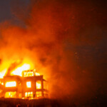 Flames rise from a structure as the Palisades fire burns during a windstorm on the west side of Los Angeles, California, U.S. January 8, 2025. REUTERS/Ringo Chiu