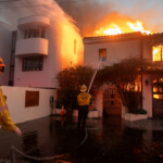 Firefighters battle the Palisades fire as it burns during a windstorm on the west side of Los Angeles, California, U.S. January 8, 2025. REUTERS/Ringo Chiu