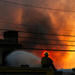 A firefighter battles the Palisades Fire as it burns during a windstorm on the west side of Los Angeles, California, U.S. January 8, 2025. REUTERS/Ringo Chiu