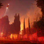 A helicopter flies, as smoke rises from the Sunset Fire in the hills overlooking the Hollywood neighborhood of Los Angeles, California, U.S. January 8, 2025. REUTERS/David Swanson