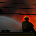 A firefighter battles the Palisades Fire as it burns during a windstorm on the west side of Los Angeles, California, U.S. January 8, 2025. REUTERS/Ringo Chiu