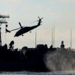 A Turkish navy ship and a helicopter take part in the Blue Homeland-Mavi Vatan 2025 military exercise in the Aegean, off the shores of Turkey's coastal town of Marmaris January 9, 2025. REUTERS/Kenan Gurbuz