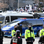 A vehicle believed to be carrying impeached South Korean President Yoon Suk Yeol arrives on January 18, 2025 in Seoul, South Korea. Kim Min-Hee/Pool via REUTERS