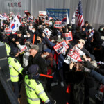 Pro-Yoon protesters participate in a rally outside a court as South Korea's impeached President Yoon Suk Yeol plans to attend a court hearing to fight a request by investigators to extend his detention on accusations of insurrection, in Seoul, South Korea, January 18, 2025. REUTERS/Kim Hong-Ji