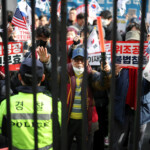 Pro-Yoon protesters participate in a rally outside a court as South Korea's impeached President Yoon Suk Yeol plans to attend a court hearing to fight a request by investigators to extend his detention on accusations of insurrection, in Seoul, South Korea, January 18, 2025. REUTERS/Kim Hong-Ji