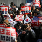 Pro-Yoon protesters participate in a rally outside a court as South Korea's impeached President Yoon Suk Yeol plans to attend a court hearing to fight a request by investigators to extend his detention on accusations of insurrection, in Seoul, South Korea, January 18, 2025. REUTERS/Kim Hong-Ji