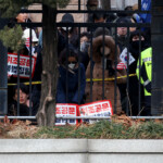 Pro-Yoon protesters participate in a rally outside a court on the day South Korea's impeached President Yoon Suk Yeol plans to attend a court hearing to fight a request by investigators to extend his detention on accusations of insurrection, in Seoul, South Korea, January 18, 2025. REUTERS/Kim Hong-Ji