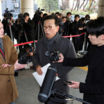Seok Dong-hyeon, a lawyer for South Korea's impeached President Yoon Suk Yeol, speaks to members of media upon his arrival at a court as Yoon plans to attend a court hearing to fight a request by investigators to extend his detention on accusations of insurrection, in Seoul, South Korea, January 18, 2025. REUTERS/Kim Hong-Ji/Pool