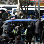 A motorcade believed to be carrying South Korea's impeached President Yoon Suk Yeol arrives at a court for a hearing to fight a request by investigators to extend his detention on accusations of insurrection, in Seoul, South Korea, January 18, 2025. REUTERS/Kim Hong-Ji/Pool Impeached South Korean President Yoon