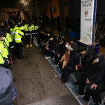 Pro-Yoon protesters are detained during a rally outside a court on the day South Korea's impeached President Yoon Suk Yeol plans to attend a court hearing to fight a request by investigators to extend his detention on accusations of insurrection, in Seoul, South Korea, January 18, 2025. REUTERS/Kim Hong-Ji